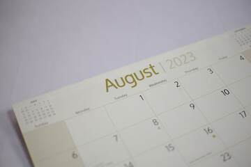 Top view of a closeup calendar of August 2023. Selective focus shot of a calendar on august page. 