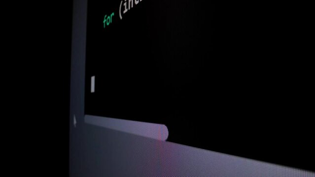 Closeup macro shot movement of coding script moving across LED screen with real-time AI-generated typing, showcasing advanced AI learning in optimization, debug and coding for software development.