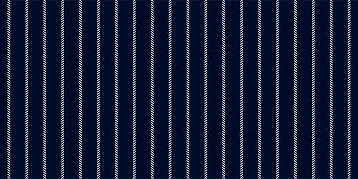 Pinstripe dark blue and white seamless pattern with narrow lines. Classic wool suit fabric. Elegant masculine design. Simple monochrome background. Twill variegated woolen material