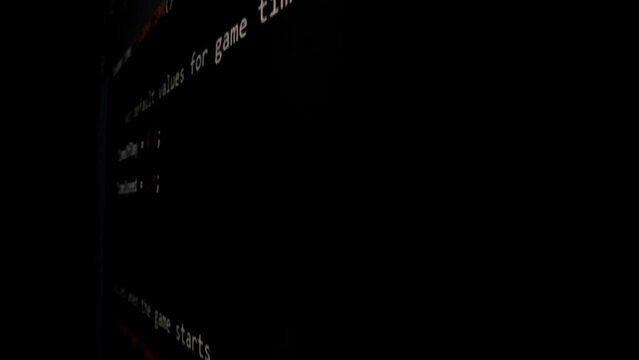 Closeup macro shot movement of coding script moving across LED screen with real-time AI-generated typing, showcasing advanced AI learning in optimization, debug and coding for software development.