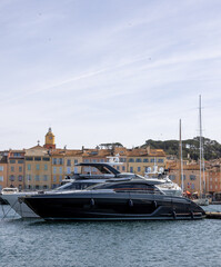 Saint Tropez with the famous Notre Dame de l'Assomption church, marina with yachts and sailing boats on the Cote d'Azur, French Riviera