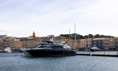 Saint Tropez with the famous Notre Dame de l'Assomption church, marina with yachts and sailing boats on the Cote d'Azur, French Riviera