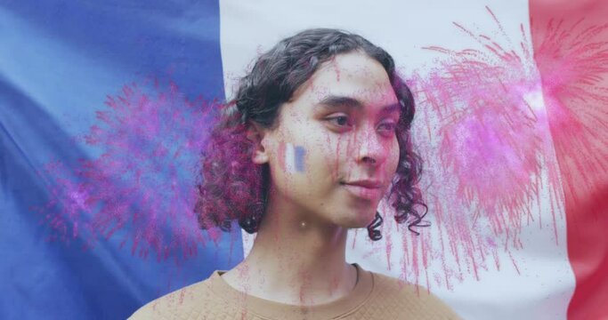 Animation of flag of france over non-binary person smiling