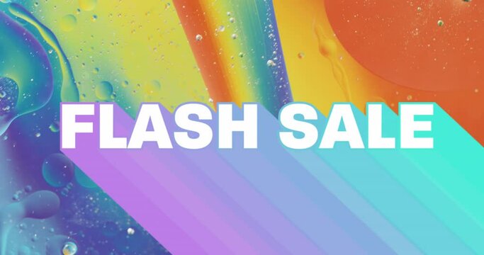 Animation of flash sale text over close up of liquid and baubles