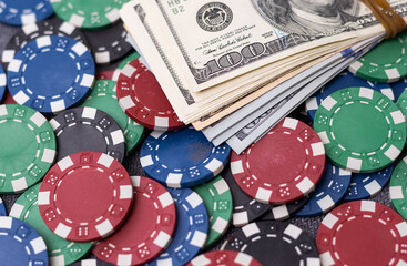 Cash money dollar bills and casino chips. Gambling casino chips and casino tokens