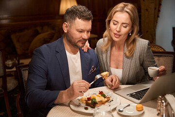 Woman flirting with boss during lunch at restaurant