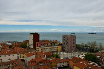 View of the town of Koper in Littoral region of Slovenia with Tomos tower block with Adriatic sea behind