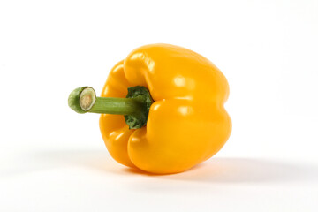 Yellow bell pepper with green stem on white BG