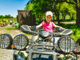 Girl riding an electric quad bike