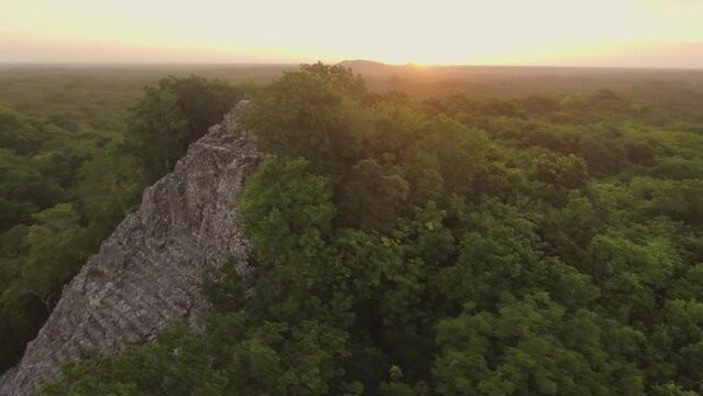 Aerial Drone View Yucatan Coba Mayan Pyramids Ruins at Sunset Mexico