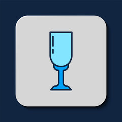 Filled outline Glass of champagne icon isolated on blue background. Vector