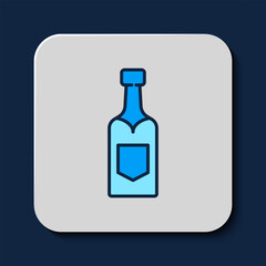 Filled outline Champagne bottle icon isolated on blue background. Vector