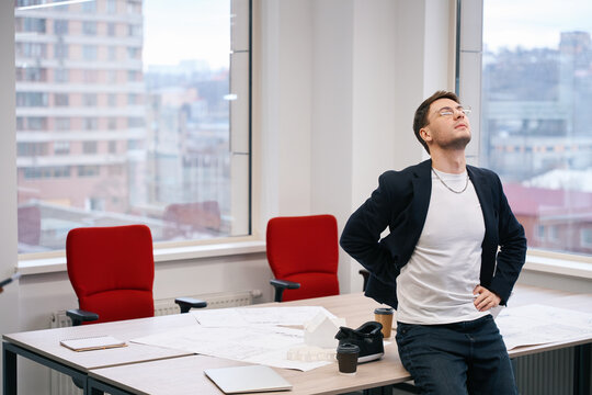 Man feeling pain in spine in the office
