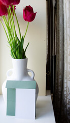 Greeting, postcard, birthday, wedding invite mock up white card with the bouquet of pink tulips