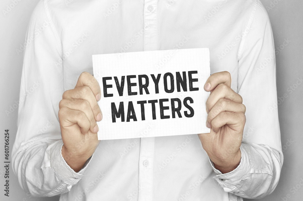 Poster man holding a paper card with text everyone matters