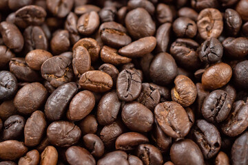 Fresh roasted brown coffee beans background