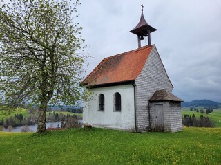 Fototapeta na wymiar Old Church on Hill in Bavarian Countryside - Germany