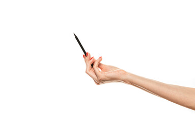 Close-up Female hand writing with a pencil, black wooden pencil in hand, isolated on white background with clipping path