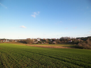Blue sky over fields and meadows.