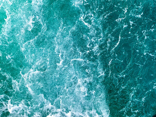 Background shot of aqua sea water surface. Blue