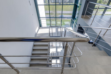 Obraz premium stairs emergency and evacuation exit stair in up ladder in a new office building.