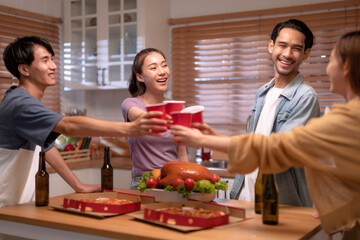 Group of Asian friends enjoying an evening party together at home.	
