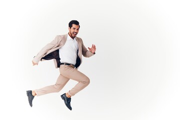 Fototapeta na wymiar beige man businessman business happy winner victory running jumping suit smiling