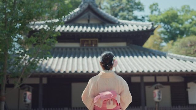 Asian woman wearing japanese traditional kimono dress walking in old town, Kimono girl enjoy outdoor lifestyle activity travel in the city of Japan