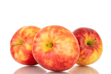 Three ripe red apples, macro, isolated on white background.