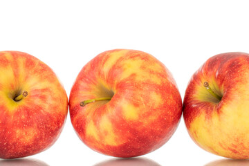 Three ripe red apples, macro, isolated on white background.