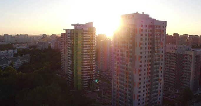 New high-rise residential houses in Moscow in rays of setting sun, Drone view