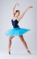 Ballet, creative dance and woman with talent, wellness and freedom with fitness and energy on grey studio background. Practice, female dancer and ballerina with formal training, performance and hobby