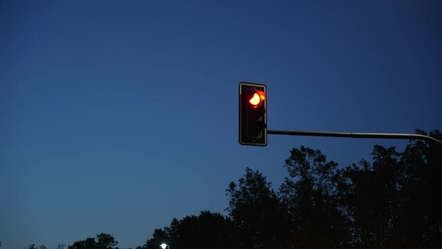 Traffic light works at night time, close-up. night city traffic control.  Urban life, transportation traffic Copy space