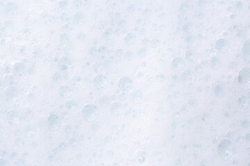 Soap foam close-up as a background. Facial cleanser foam bubbles. A foam party.