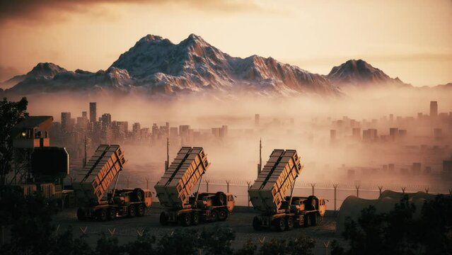Air defense battery on the city background