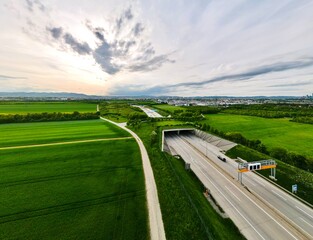 Aerial view of Highway with ecoduct bridge overpass for wild animals and pedestrians in Vienna Austria