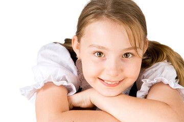 A smiling blond girl with brown eyes