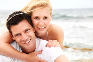 Happy couple on the beach. Shallow DoF with focus on the man.