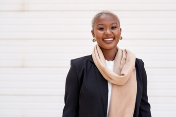 Portrait, business and black woman with a smile, career and startup success against a white...