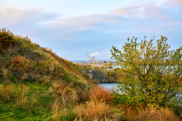 Autumn landscape with big river and blue sky.