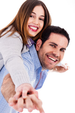 Young man giving piggy back ride to his lover on a isoalted white background