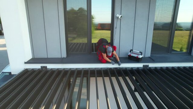 Contractor Installing Modern Carport Pergola