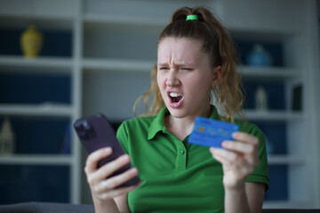 Internet fraud. Nervous sad upset unhappy confused young woman, stressed worried lady having...