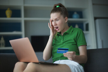 Internet fraud. Nervous sad upset unhappy confused young woman, stressed worried lady having...