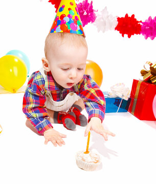 Baby boy celebrating his first birthday, isolated