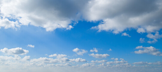 Blue sky with clouds. Wide photo.