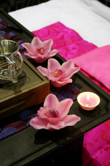 Obraz na płótnie Canvas Beautiful pink spa with flower candles