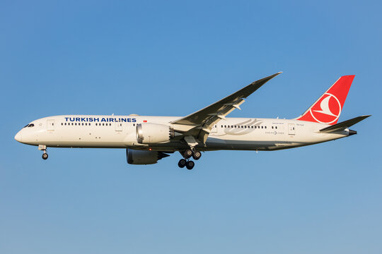 Vienna, Austria - 30 April, 2023: Turkish Airlines Dreamliner aircraft landing in front of clear blue evening sky