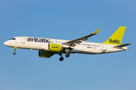 Vienna, Austria - 30 April, 2023: Air Baltic landing with a modern Airbus A220 airliner aircraft in Vienna coming from Tallinn