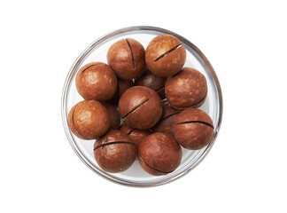 Macadamia nuts in bowl on a white